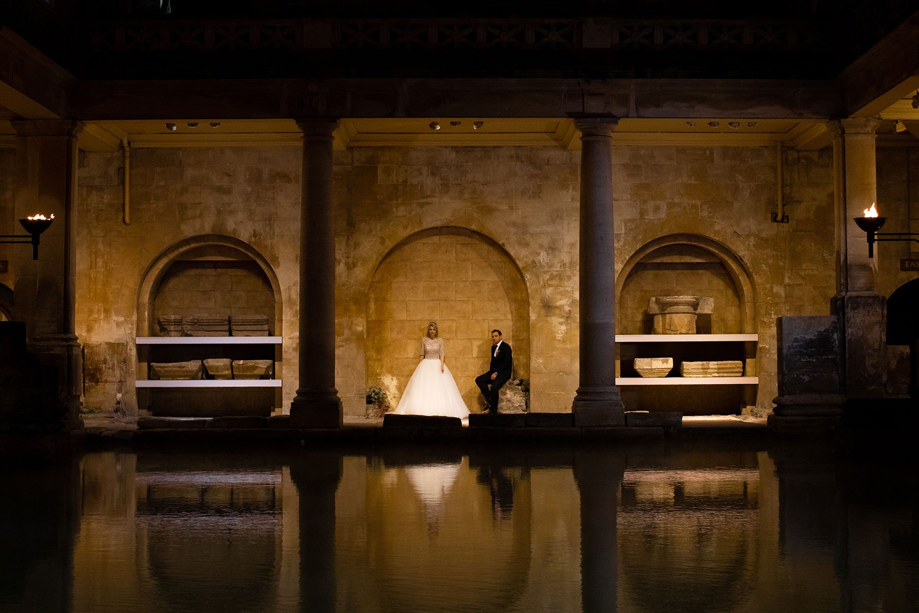 couple sitting by the roman baths