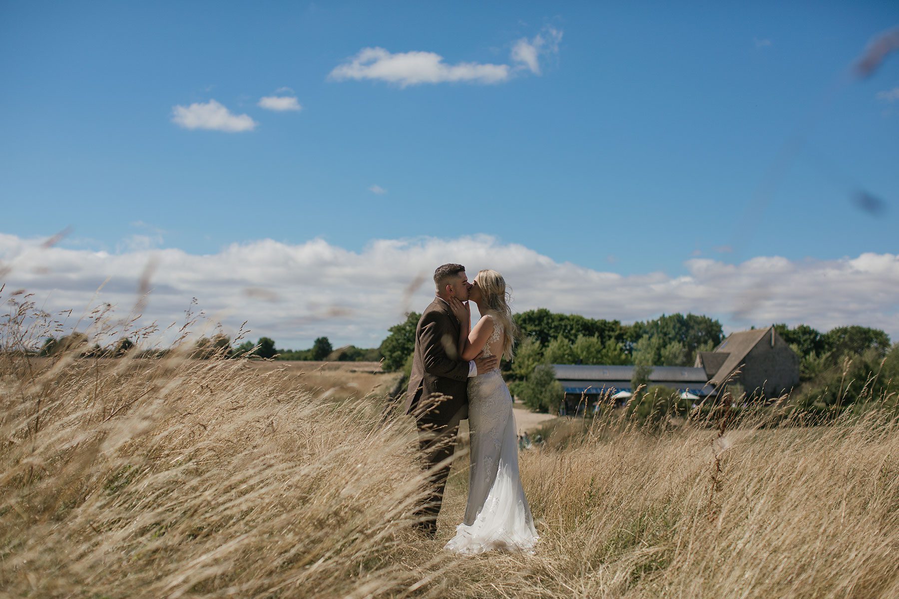 blue skies over stone barn