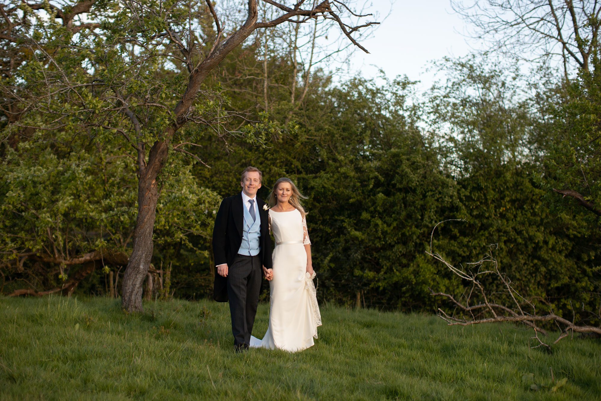 lexi and will standing in the field