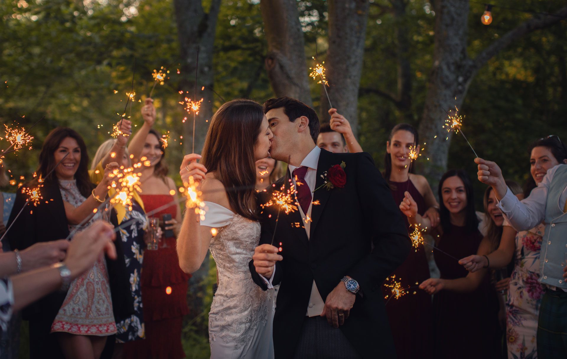 couple holding sparklers